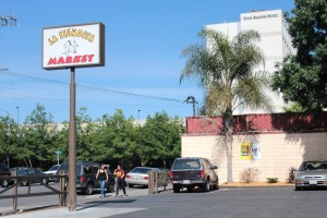 La Tiendita Market on East Palo Alto’s west side sits in the shadow of the swanky Four Seasons Hotel, developed by the city in the early 2000s to increase its tax base. (Alexei Koseff/Peninsula Press)